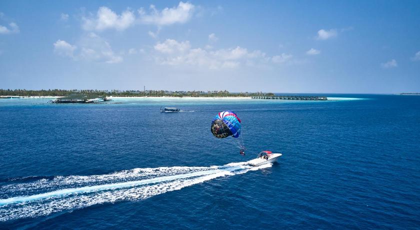 Maldives parasailing and lagoon experiences with resort view